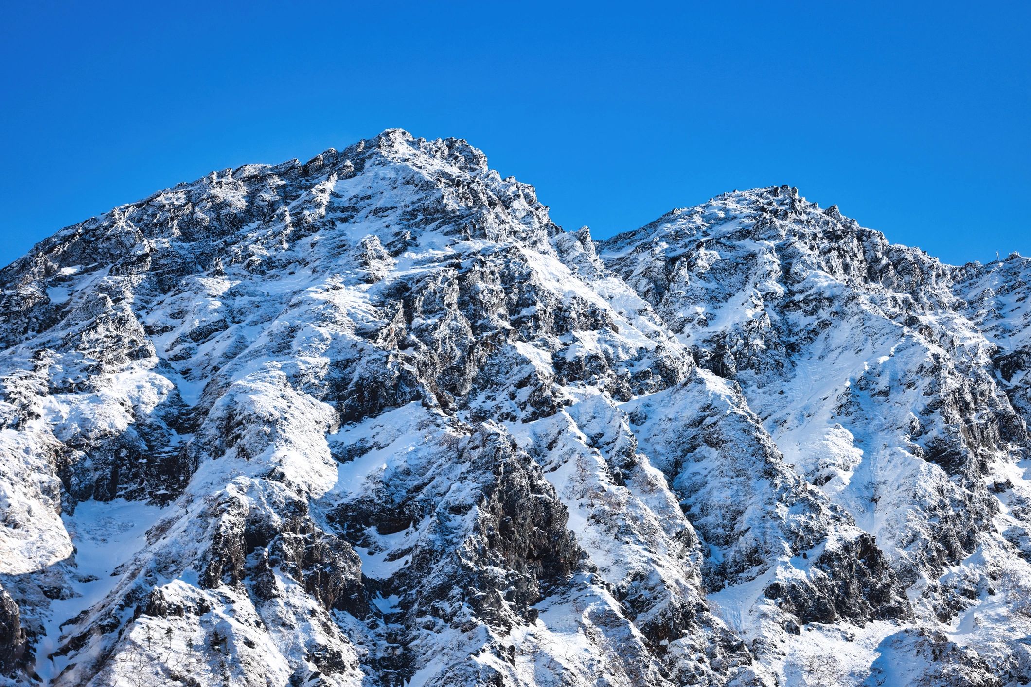 Snow-covered mountain range for a winter camp escape